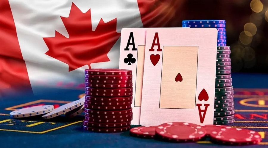 A stack of poker chips and two playing cards showing aces are placed on a casino table with the Canadian flag in the background.