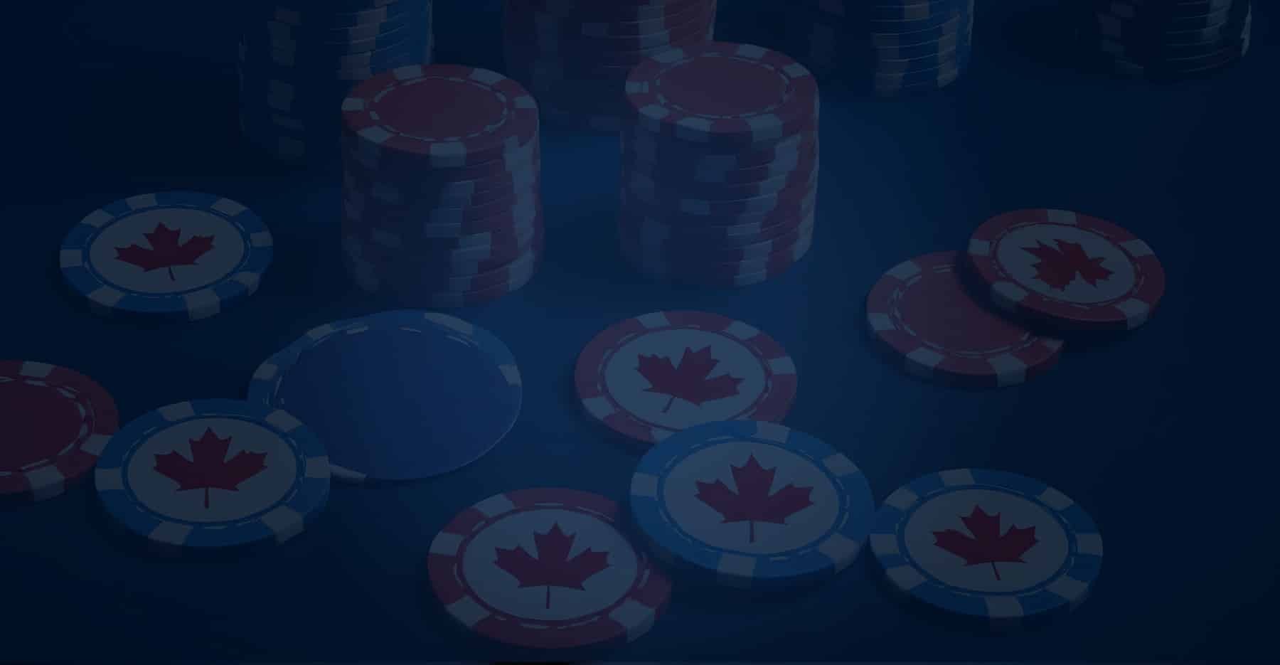 Stacks and scattered poker chips featuring the Canadian maple leaf symbol on a dark surface.